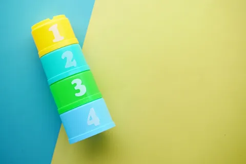 Bright, colorful numbered stacking cups for early learning play