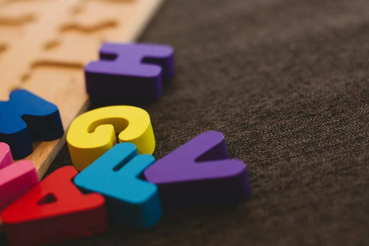 Colorful foam alphabet letters on a table
