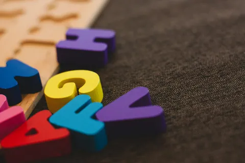 Colorful foam alphabet letters on a table